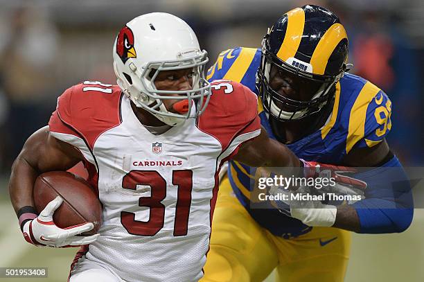 David Johnson of the Arizona Cardinals rushes against the St. Louis Rams at the Edward Jones Dome on December 6, 2015 in St. Louis, Missouri.