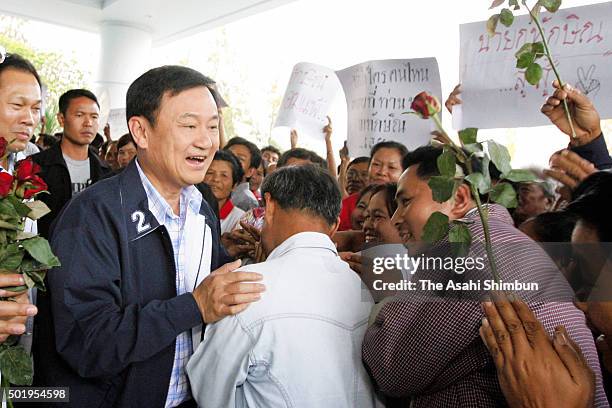 Thai Prime Minister Thaksin Shinawatra is welcomed by his supporters during his visit to Nakhon Ratchasima Province on March 15, 2006 in Nakhon...
