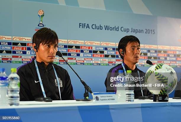 Sanfrecce Hiroshima coach Hajime Moriyasu and captain Toshihiro Aoyama talk to the media during a press conference at International Stadium Yokohama...