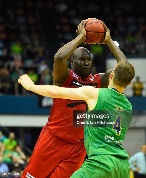 Nathan Jawai of the Wildcats looks to pass the ball past Nicholas Kay of the Crocodiles during the round 11 NBL match between the Townsville...