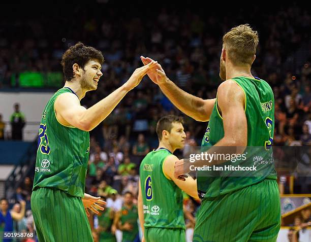 Clint Steindl of the Crocodiles congratulates Mitch Young of the Crocodiles after scoring a slam dunk during the round 11 NBL match between the...