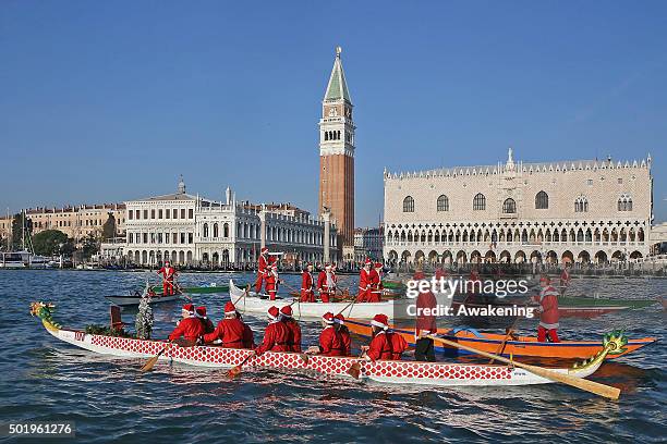 Rowers dressed as Santa get ready to race in the annual Father Christmas Regatta on the Grand Canal on December 19, 2015 in Venice, Italy. The...