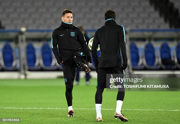 Barcelona forwards Lionel Messi and Neymar attend a training session at the Club World Cup football tournament in Yokohama on December 19, 2015. AFP...