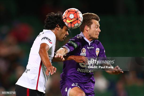 Nikolai Topor-Stanley of the Wanderers and Chris Harold of the Glory contest a header during the round 11 A-League match between the Perth Glory and...