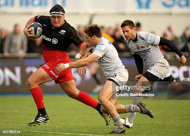 Jamie George of Saracens breaks away from Julien Blanc of Oyonnax to score a try during the European Rugby Champions Cup match between Saracens and...