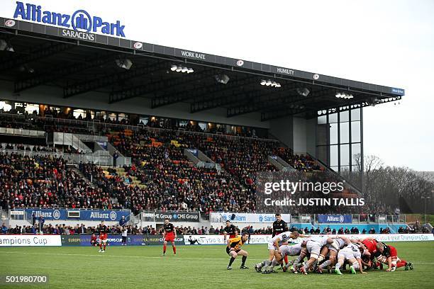 Players contest a scrum during the European Rugby Champions Cup rugby union match between Saracens and Oyonnax at Allianz park in north London on...