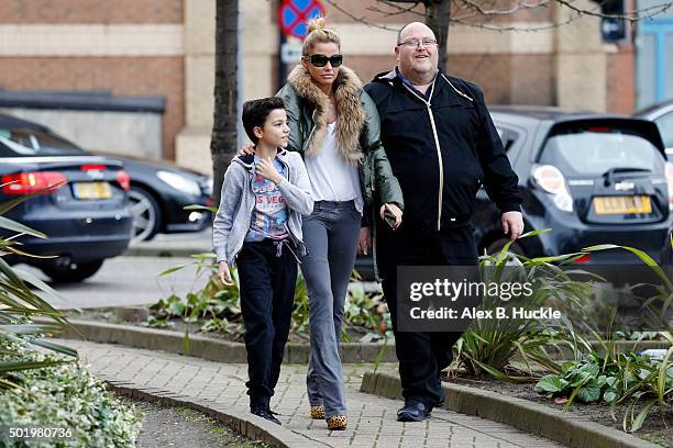 Katie Price arrives at the New Victoria Theatre with son Junior on December 19, 2015 in Woking, England.