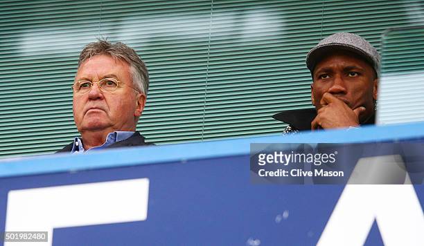 Chelsea interim manager Guus Hiddink and Didier Drogba of Montreal Impact are seen on the stand during the Barclays Premier League match between...