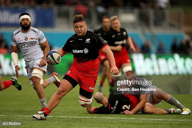 Richard Barrington of Saracens makes a break during the European Rugby Champions Cup match between Saracens and Oyonnax at Allianz Park on December...