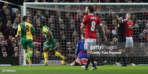 Cameron Jerome of Norwich City celebrates scoring their first goal during the Barclays Premier League match between Manchester United and Norwich...