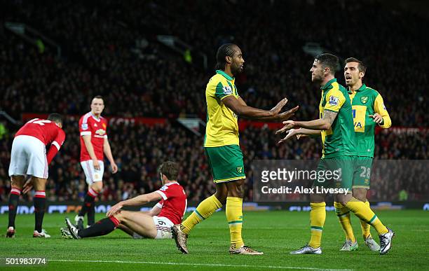 Cameron Jerome of Norwich City celebrates scoring his team's first goal with his team mates Robbie Brady and Gary O'Neil during the Barclays Premier...