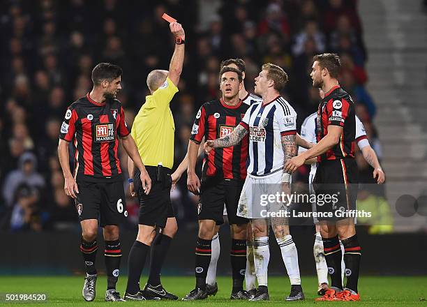 James McClean of West Bromwich Albion is shown a red card by referee Mike Dean after fouling Adam Smith of Bournemouth during the Barclays Premier...