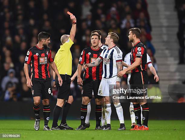 James McClean of West Bromwich Albion is shown a red card by referee Mike Dean after fouling Adam Smith of Bournemouth during the Barclays Premier...