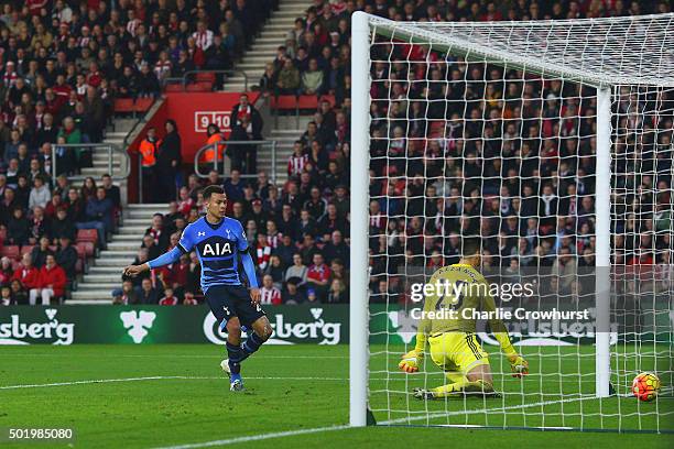 Dele Alli of Tottenham Hotspur beats goalkeeper Paulo Gazzaniga of Southampton to score their second goal during the Barclays Premier League match...