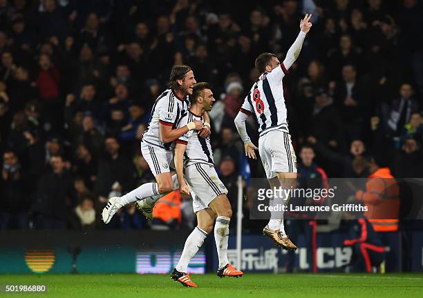 Gareth McAuley of West Bromwich Albion celebrates scoring his team's first goal with his team mate Jonas Olsson and Craig Gardner during the Barclays...
