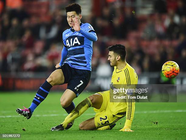 Son Heung-Min of Tottenham Hotspur is challenged by goalkeeper Paulo Gazzaniga of Southampton during the Barclays Premier League match between...