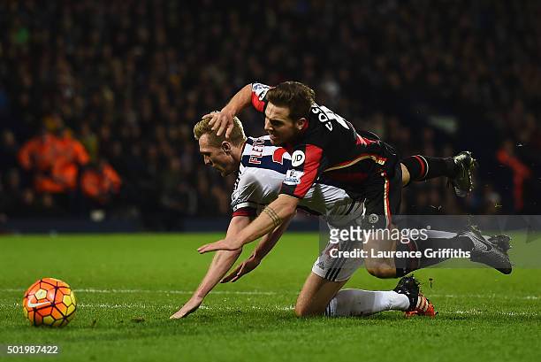Dan Gosling of Bournemouth is fouled by Darren Fletcher of West Bromwich Albion in the penalty area during the Barclays Premier League match between...