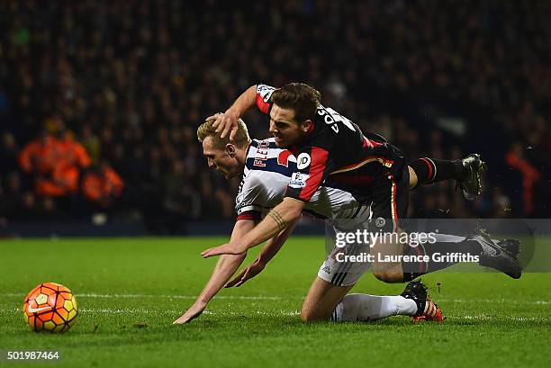 Dan Gosling of Bournemouth is fouled by Darren Fletcher of West Bromwich Albion in the penalty area during the Barclays Premier League match between...