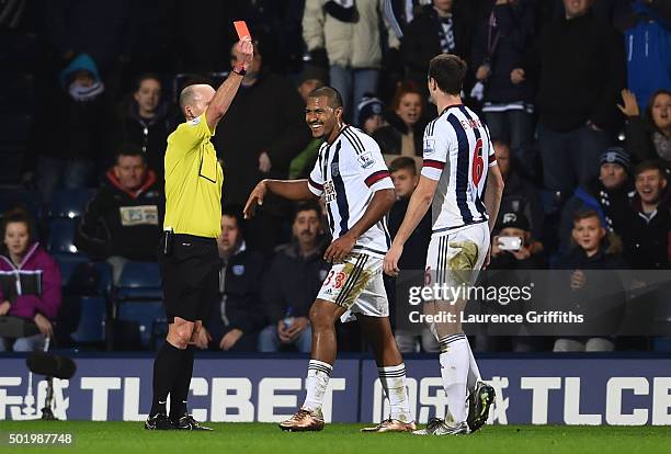 Salomon Rondon of West Bromwich Albion is shown a red card by referee Mike Dean during the Barclays Premier League match between West Bromwich Albion...