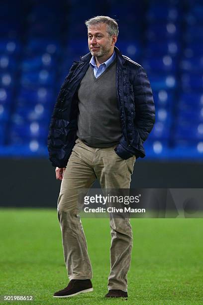 Chelsea owner Roman Abramovich is seen on the pitch to congratulate players on their 3-1 win in the Barclays Premier League match between Chelsea and...