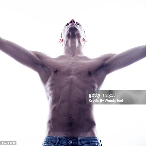 male ballet dancer posing against backlight - hairy back man stock pictures, royalty-free photos & images