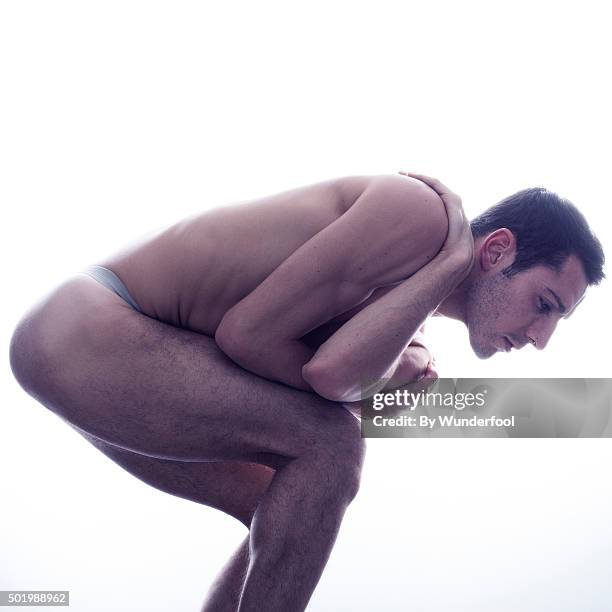 male ballet dancer posing against backlight - hairy back man stock pictures, royalty-free photos & images