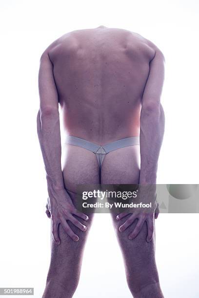 Male Ballet Dancer Posing Against Backlight High-Res Stock Photo