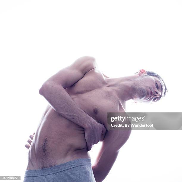 male ballet dancer posing against backlight - hairy bum 個照片及圖片檔