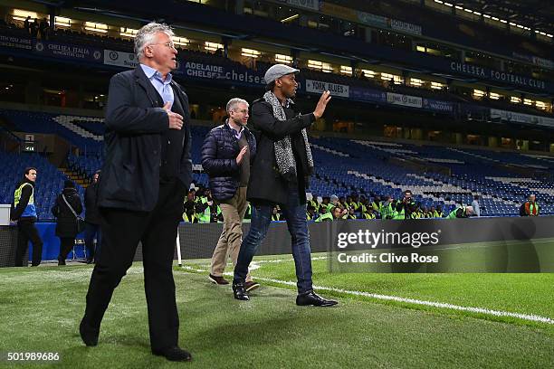 Chelsea owner Roman Abramovich , Chelsea interim manager Guus Hiddink and Didier Drogba walk into the pitch to congratulate players and staffs...