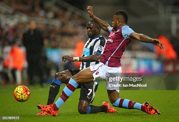 Moussa Sissoko of Newcastle United and Leandro Bacuna of Aston Villa compete for the ball during the Barclays Premier League match between Newcastle...