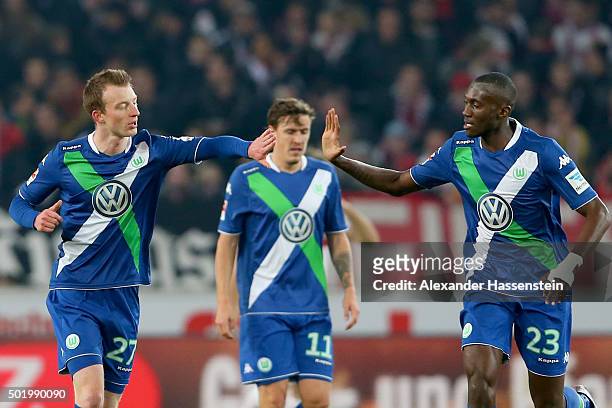 Maximilian Arnold of Wolfsburg celebrates scoring the opening goal with his team mate Joshua Guilavogui during the Bundesliga match between VfB...