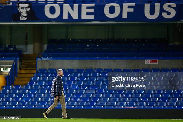 Chelsea owner Roman Abramovich walks past a banner to support Jose Mourinho after their 3-1 win in the Barclays Premier League match between Chelsea...