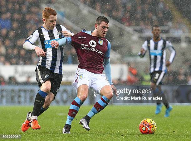 Jack Colback of Newcastle is tackled by Jordan Veretout of Aston Villa during the Barclays Premier League match between Newcastle United FC and Aston...