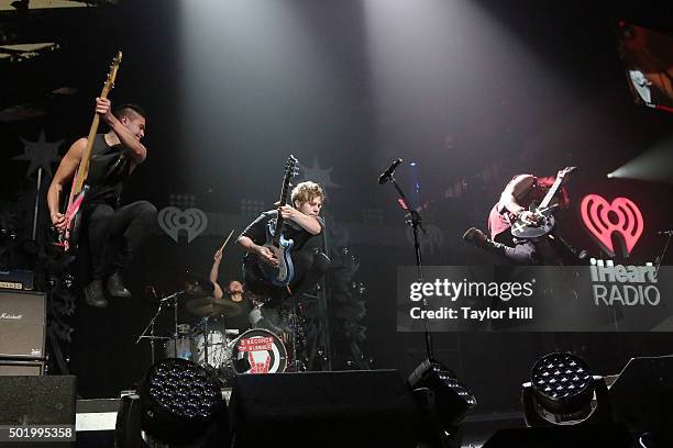 Michael Clifford, Luke Hemmings, Ashton Irwin, and Calum Hood of 5 Seconds of Summer performs during the 2015 Y100 Jingle Ball at BB&T Center on...