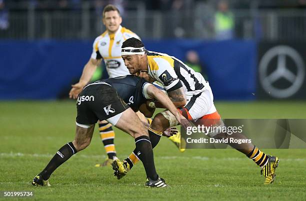 Nathan Hughes of Wasps takes on George Ford during the European Rugby Champions Cup match between Bath and Wasps at the Recreation Ground on December...