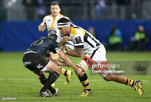 Nathan Hughes of Wasps takes on George Ford during the European Rugby Champions Cup match between Bath and Wasps at the Recreation Ground on December...