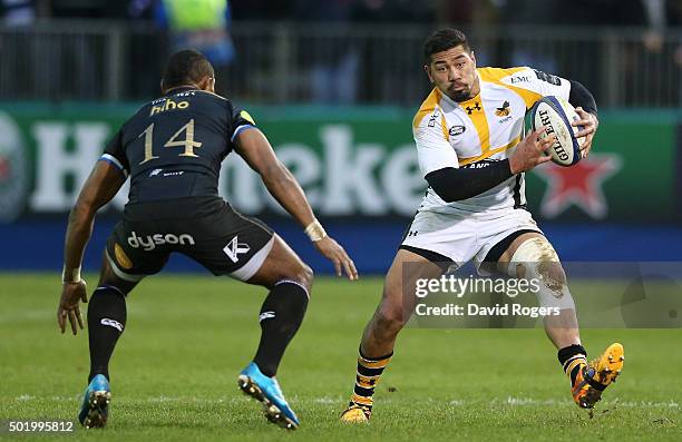 Charles Piutau of Wasps takes on Semesa Rokoduguni during the European Rugby Champions Cup match between Bath and Wasps at the Recreation Ground on...