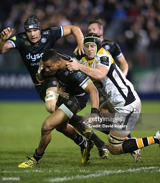 Anthony Watson of Bath is tackled by James Gaskell during the European Rugby Champions Cup match between Bath and Wasps at the Recreation Ground on...