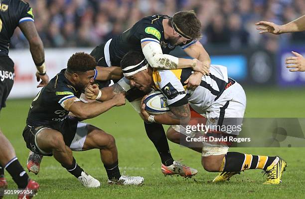 Nathan Hughes of Wasps is tackled during the European Rugby Champions Cup match between Bath and Wasps at the Recreation Ground on December 19, 2015...