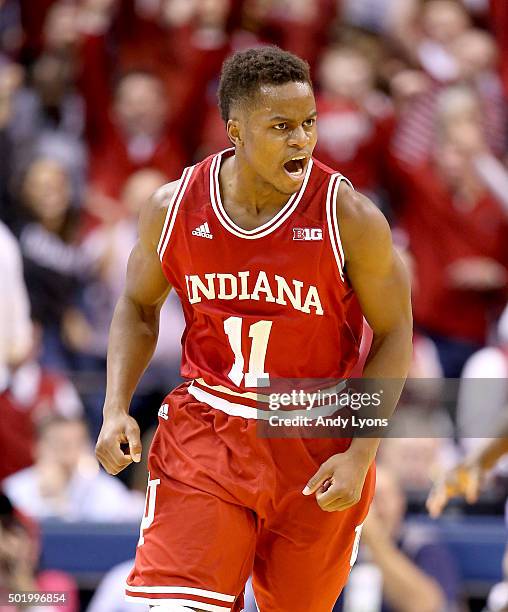 Yogi Ferrell of the Indiana Hoosiers celebrates after making a three point basket in the 80-73 win against the Notre Dame Fighting Irish during the...