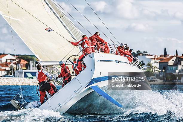 sailing crew on sailboat during regatta - yacht crew stock pictures, royalty-free photos & images
