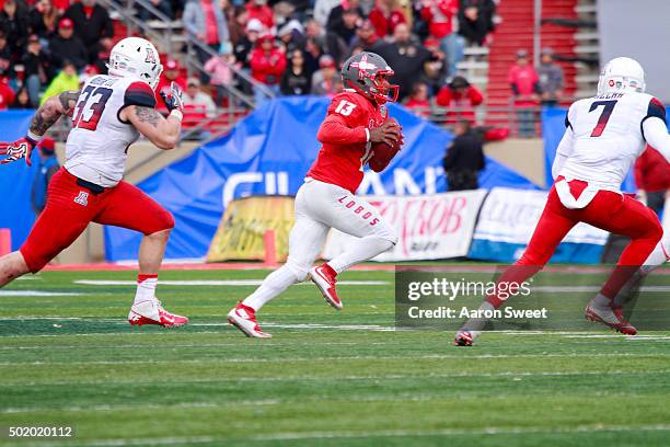 Quarterback Lamar Jordan of the New Mexico Lobos looks for an open receiver while linebacker Scooby Wright III and Free Safety Jamar Allah of the...