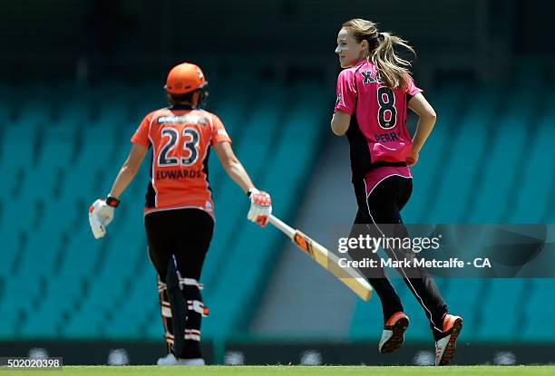 Ellyse Perry of the Sixers celebrates after taking the wicket of Charlotte Edwards of the Scorchers during the Women's Big Bash League match between...