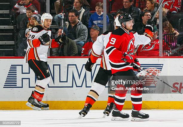 Chris Stewart of the Anaheim Ducks reacts after scoring a first-period goal as Jiri Tlusty of the New Jersey Devils skates away during the game at...