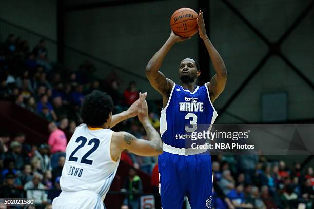 Devin Ebanks of the Grand Rapids Drive shoots against Maxie Esho of the Iowa Energy during the first half of an NBA D-League game on December 19,...