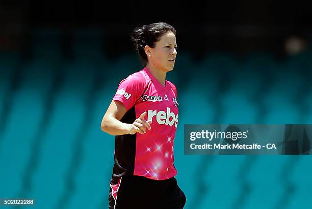 Marizanne Kapp of the Sixers celebrates with team mates after taking the wicket of Emma Biss of the Scorchers during the Women's Big Bash League...