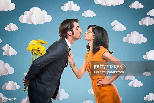 quirky stylish couple kissing - yellow retro dress stock pictures, royalty-free photos & images
