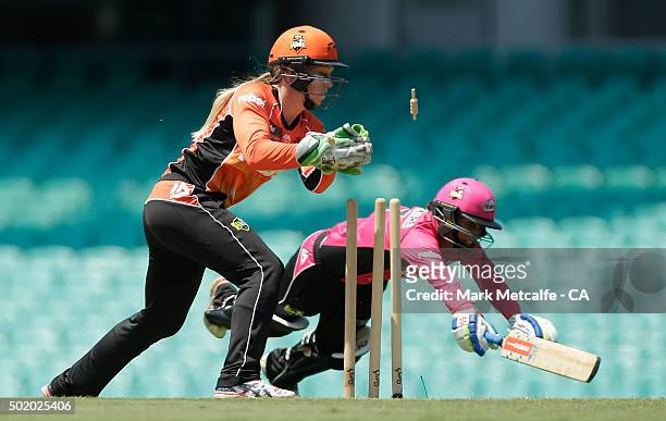 Lisa Sthalekar of the Sixers is run out by Chloe Piparo of the Scorchers during the Women's Big Bash League match between the Sydney Sixers and the...