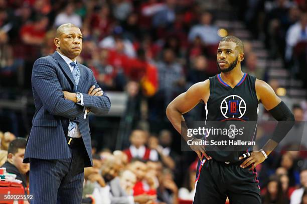 Head coach Doc Rivers of the Los Angeles Clippers and Chris Paul wait near the bench during their game against the Houston Rockets at Toyota Center...