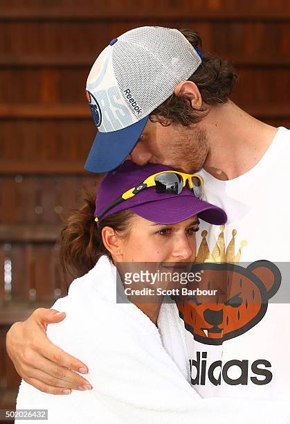 Tyrone Vickery, AFL footballer from the Richmond Tigers and husband of Arina Rodionova kisses Arina Rodionova of Victoria after she lost her Women's...